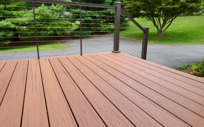 A composite deck with stairs leading to a footpath