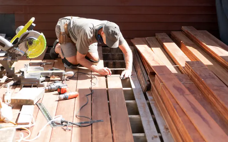 A deck builder restoring an old deck